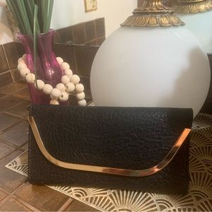 Black with gold hardware clutch